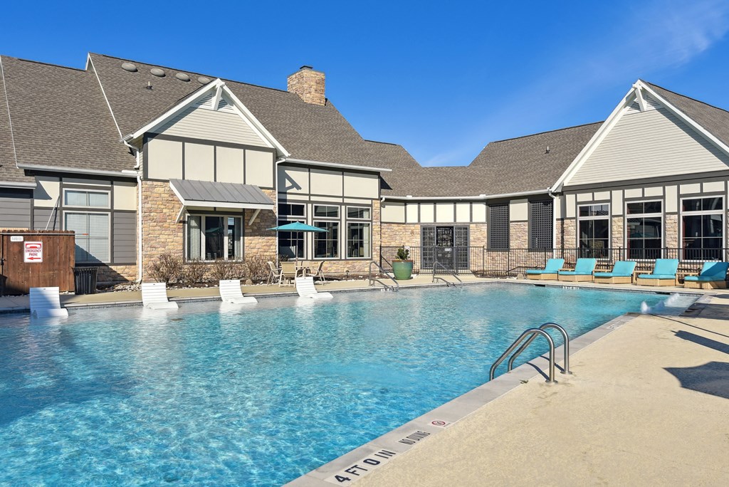 the preserve at ballantyne commons pool and building with lounge chairs