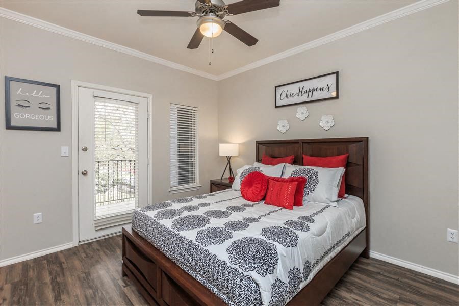 Model Primary Bedroom with Faux-wood flooring