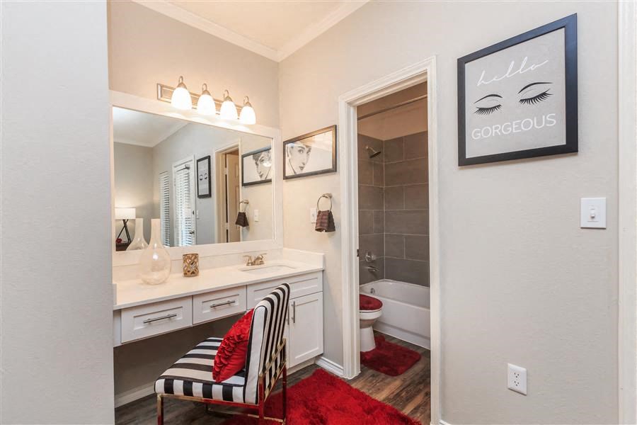 Model Primary Bedroom with Faux-wood flooring