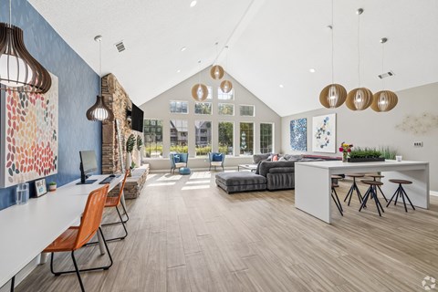 A modern office space with a long table and chairs.