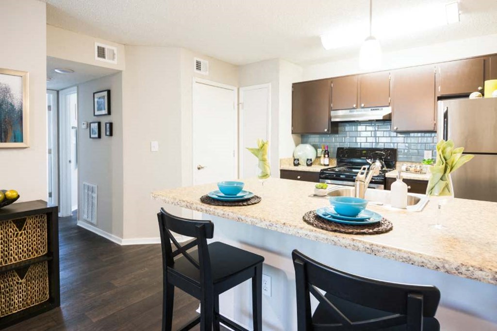 a kitchen with a plates and cups on a counter top at Eclipse Duluth