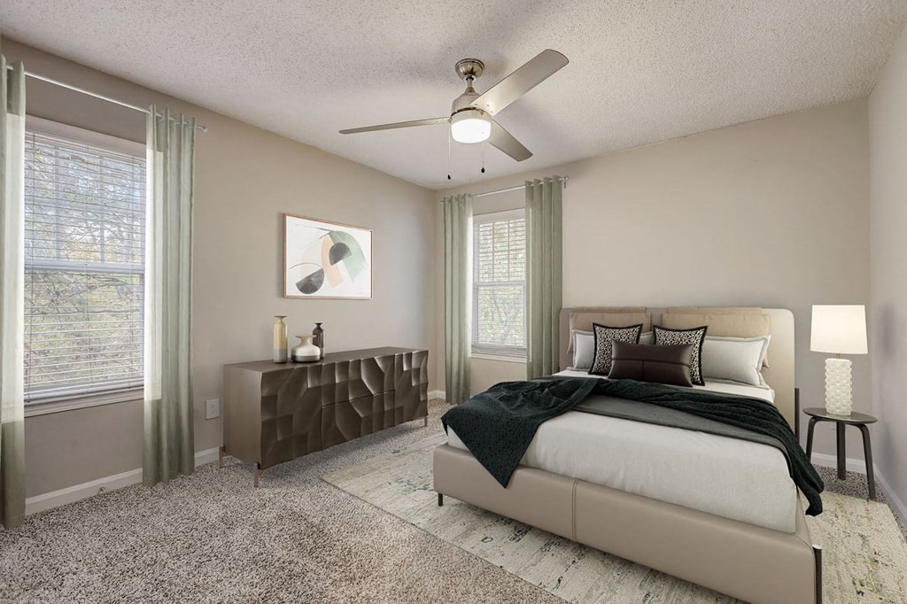 Sandy Springs, GA Pet-Friendly Apartments - Veridian at Sandy Springs - Bedroom with a Ceiling fan, Plush Carpet Flooring, and Large Windows