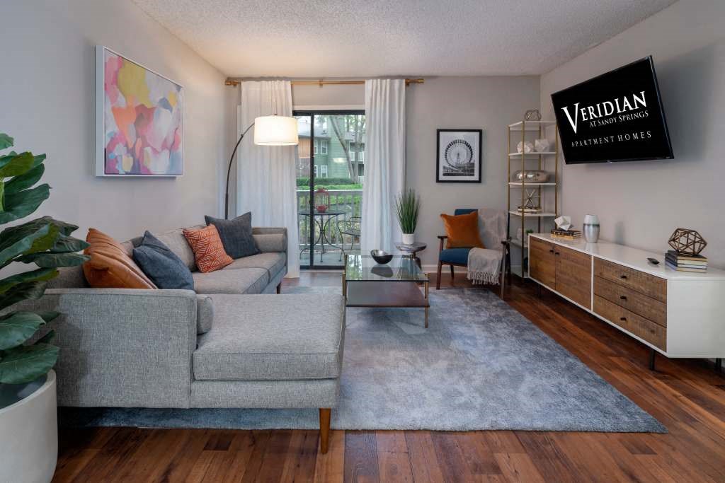 Veridian at Sandy Springs apartments interior living room with a couch and a table