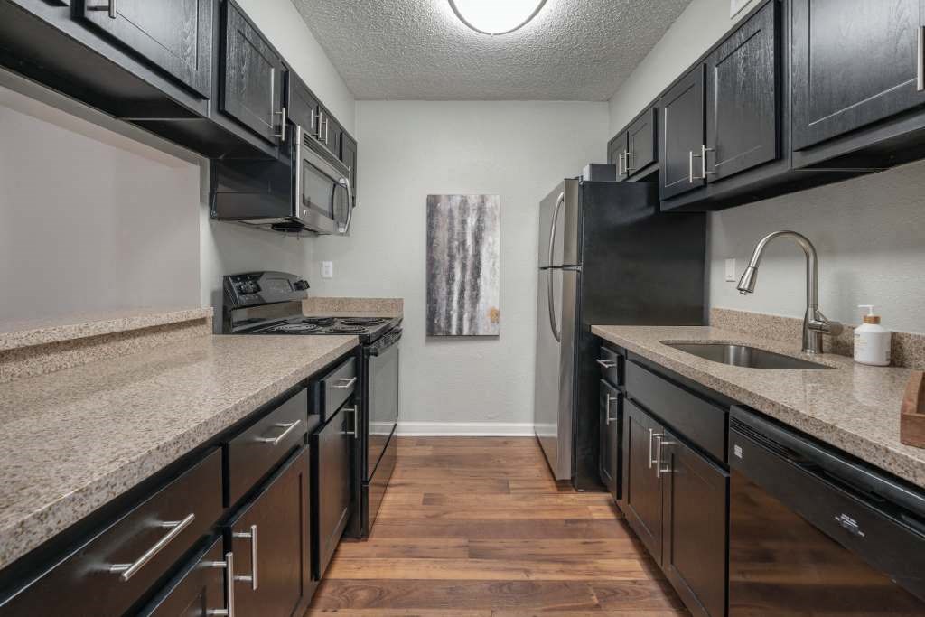 Veridian at Sandy Springs apartments interior kitchen with a sink and a refrigerator