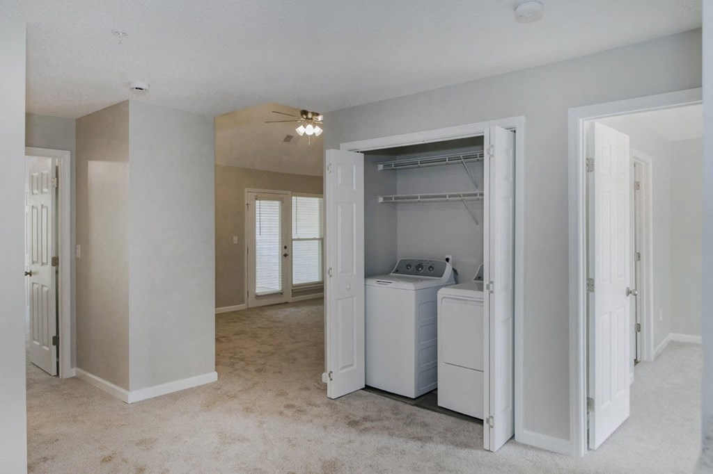 A laundry room with a washer and dryer in it.