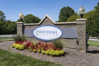 the sign at the entrance of whitehall estates