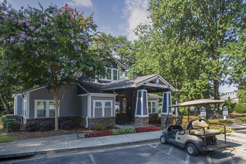 a golf cart parked in front of the leasing center at Wynnwood Vinings