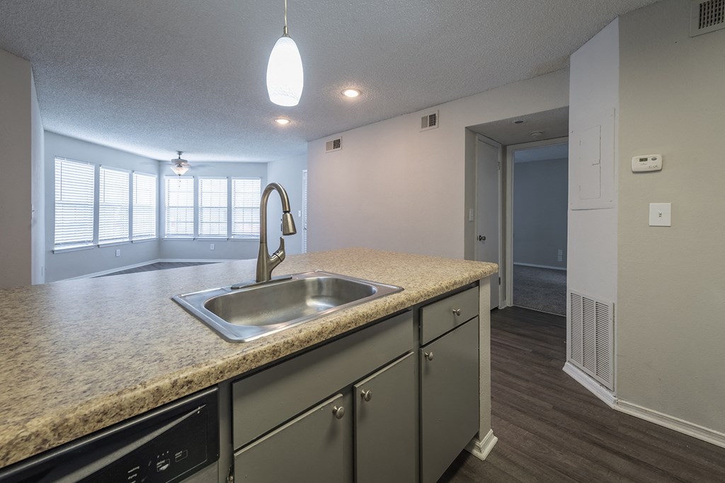 a kitchen with a sink and a window