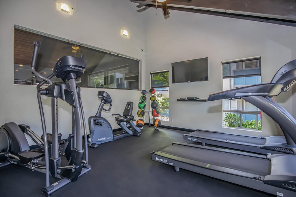 Gym with cardio equipment at Foster Creek apartments south of Seattle
