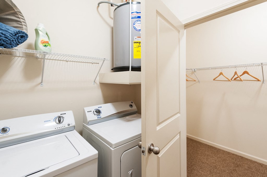 a small laundry room with a washer and dryer