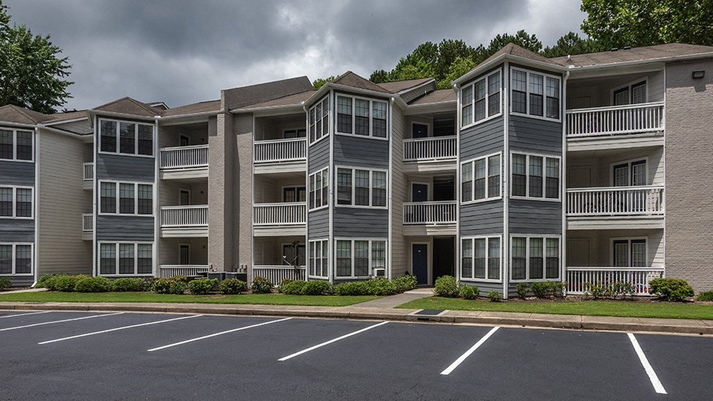 Duluth, GA Pet-Friendly Apartments - The Eclipse - Property Exterior with Private Patios/Balconies, Big Windows, and Maintained Landscaping