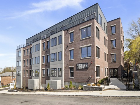 A modern brick building with the word "Jordan" on the side.