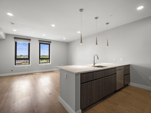 A kitchen with a sink and a window.