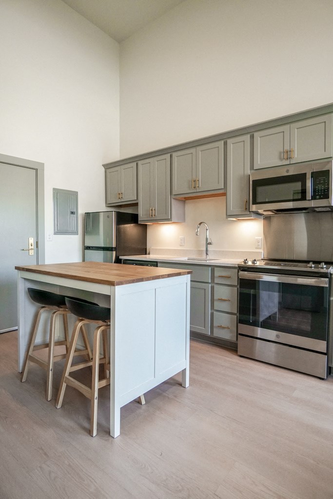 kitchen bar island in apartment at Myers Medical Lofts