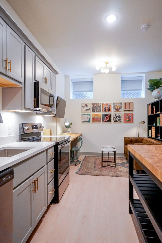 Kitchen bar island in 1st floor studio apartment at Myers Medical Lofts