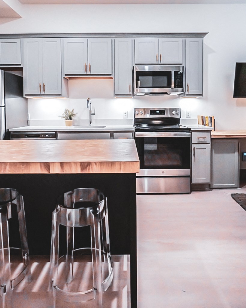 kitchen bar island in 1st floor studio apartment at Myers Medical Lofts