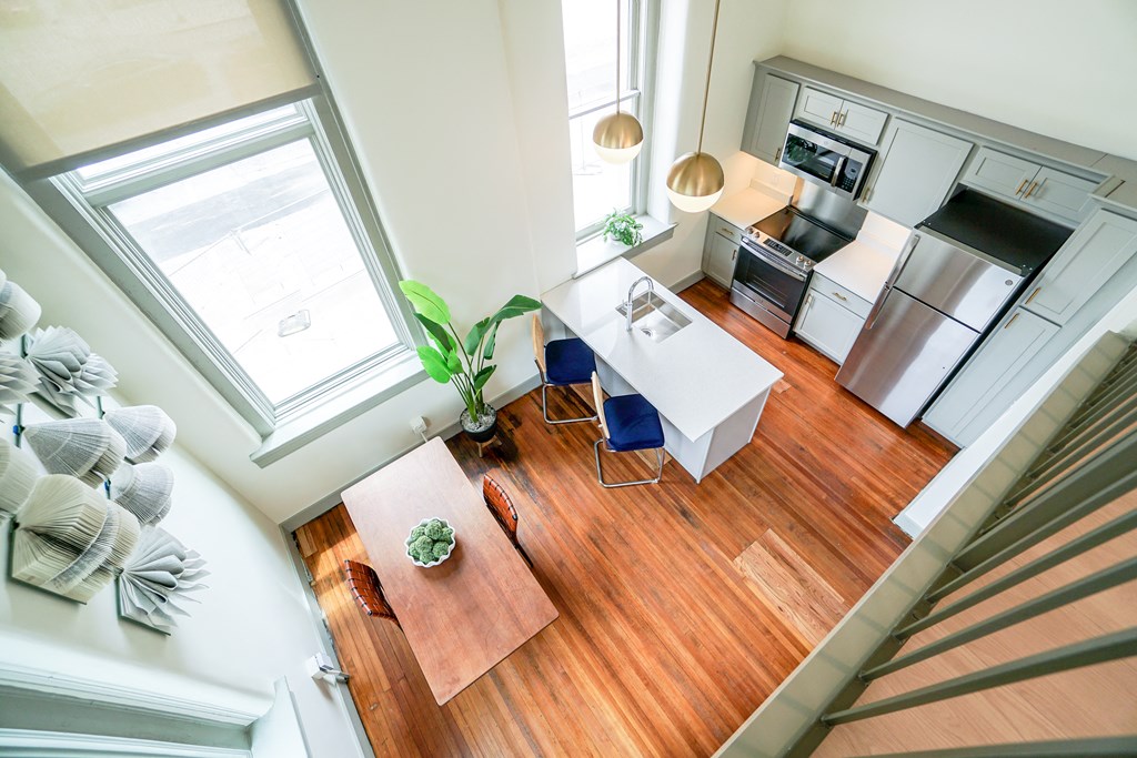 looking down from lofted bedroom at Myers Medical Lofts
