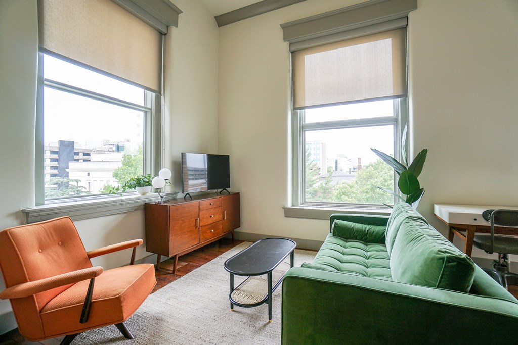 living room and 2 large windows looking out of 3rd floor unit at Myers Medical Lofts