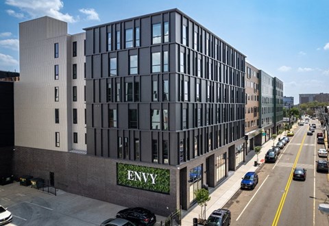 A modern building with the word ENVY on it.