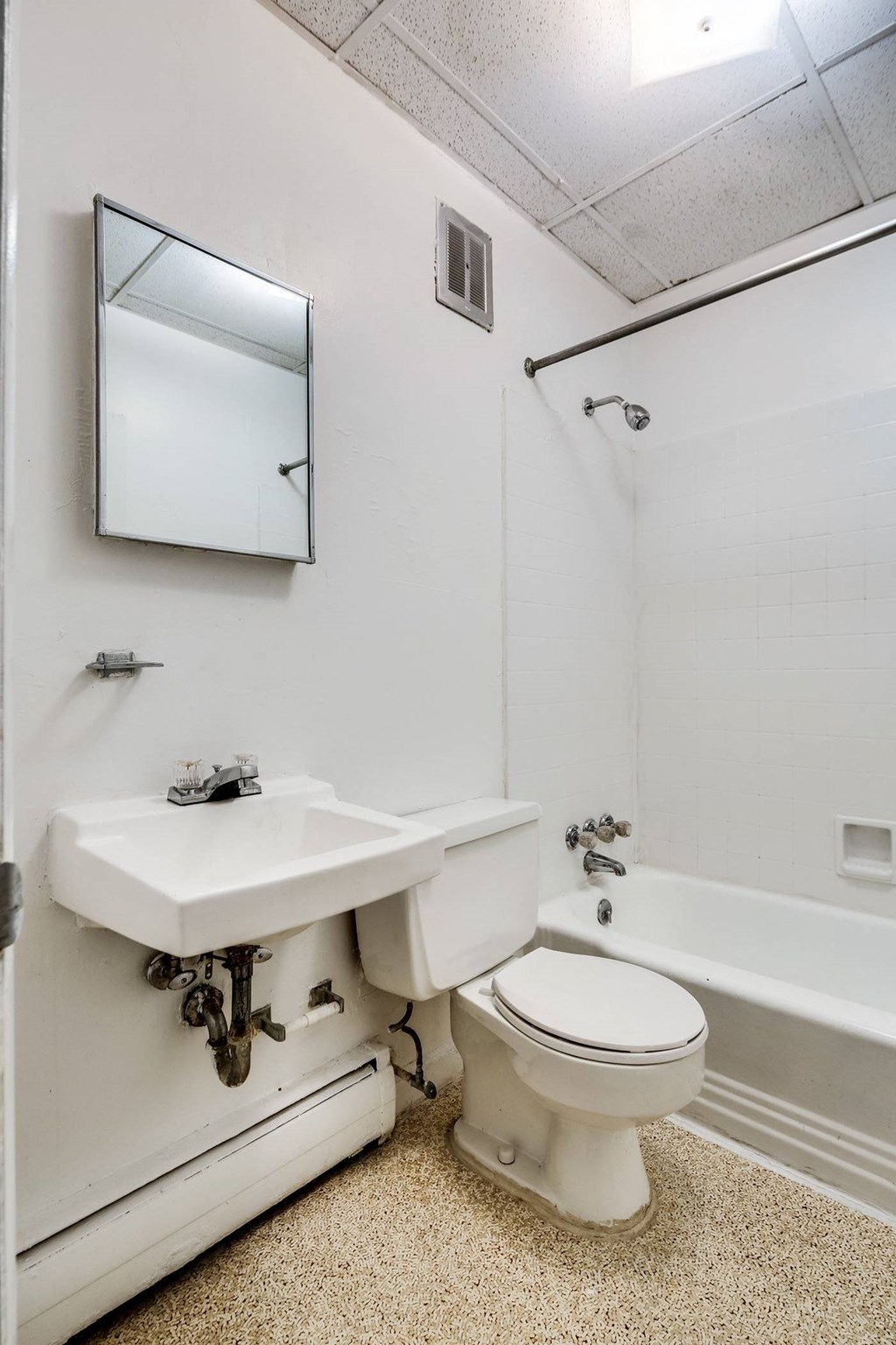 a bathroom with a sink and a toilet and a tub