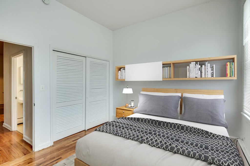 a bedroom with a bed and a closet