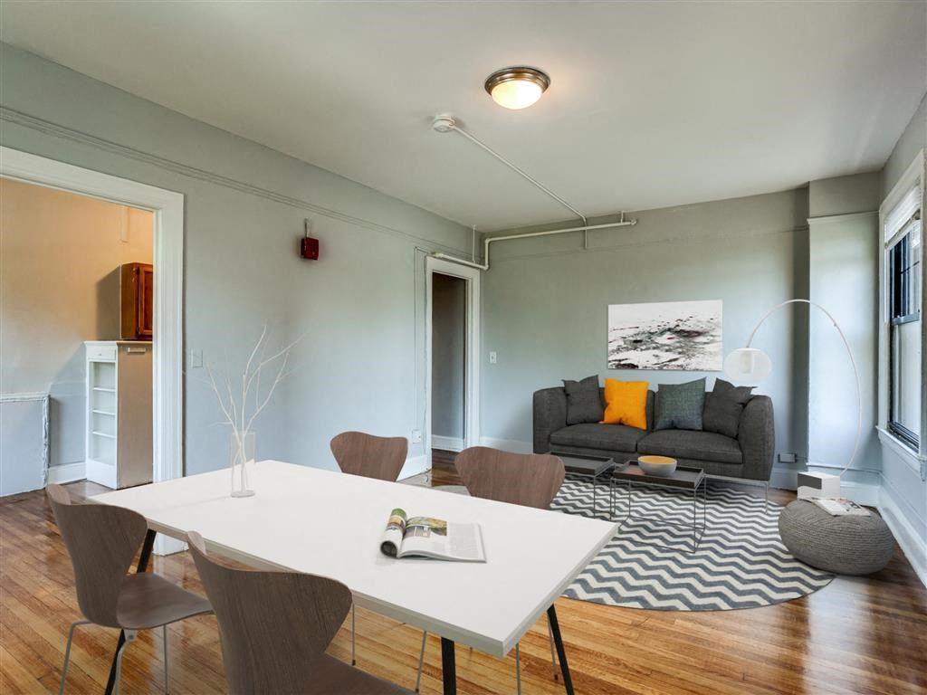 a living room with a table and a couch
