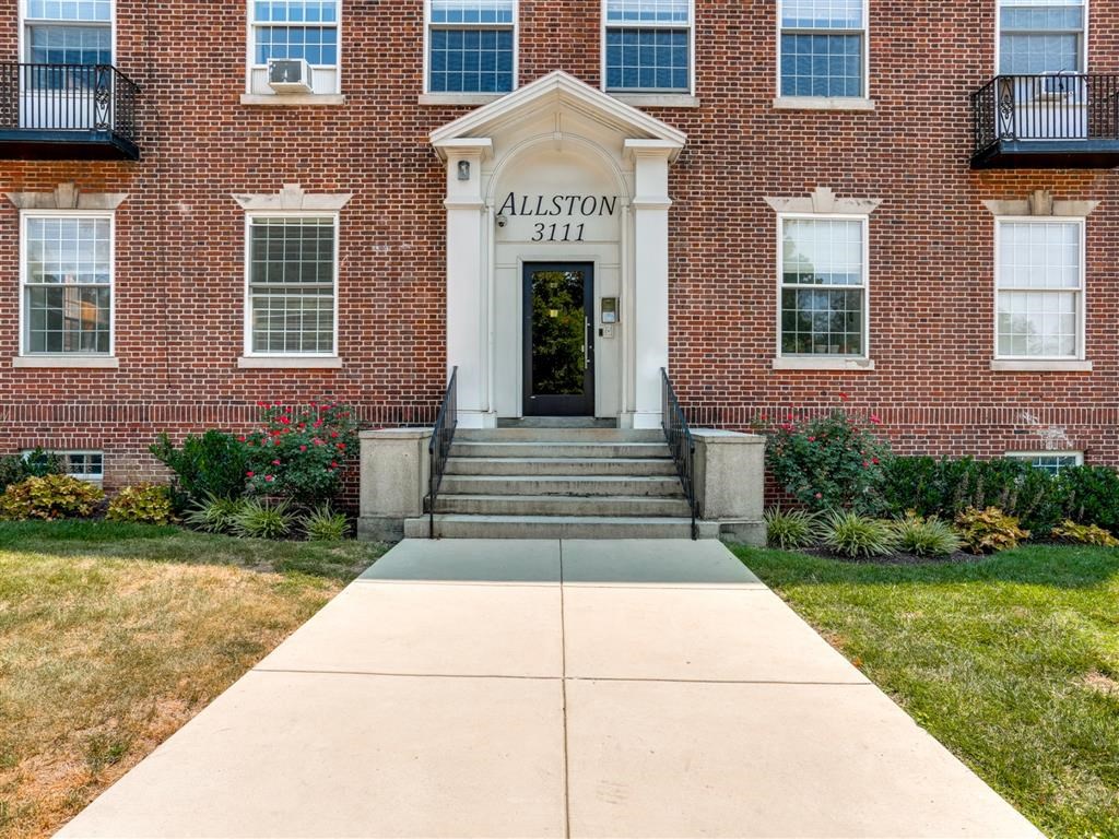 the facade of the alston stl building with stairs in front