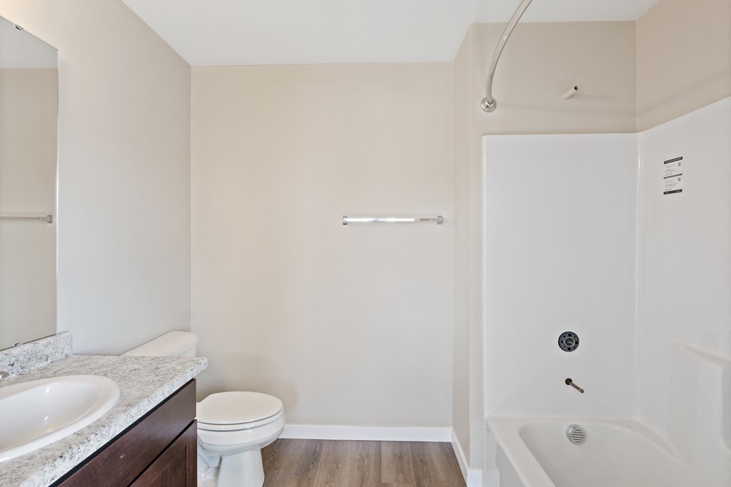 a bathroom with a sink toilet and shower and a bath tub