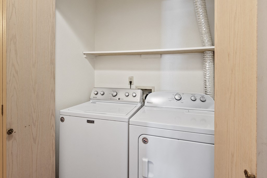 the washer and dryer in the laundry room of a home