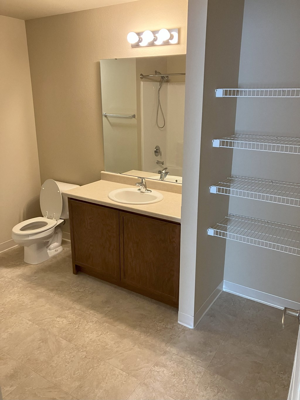 a bathroom with a sink toilet and a shower