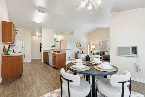 a dining room with a table and chairs