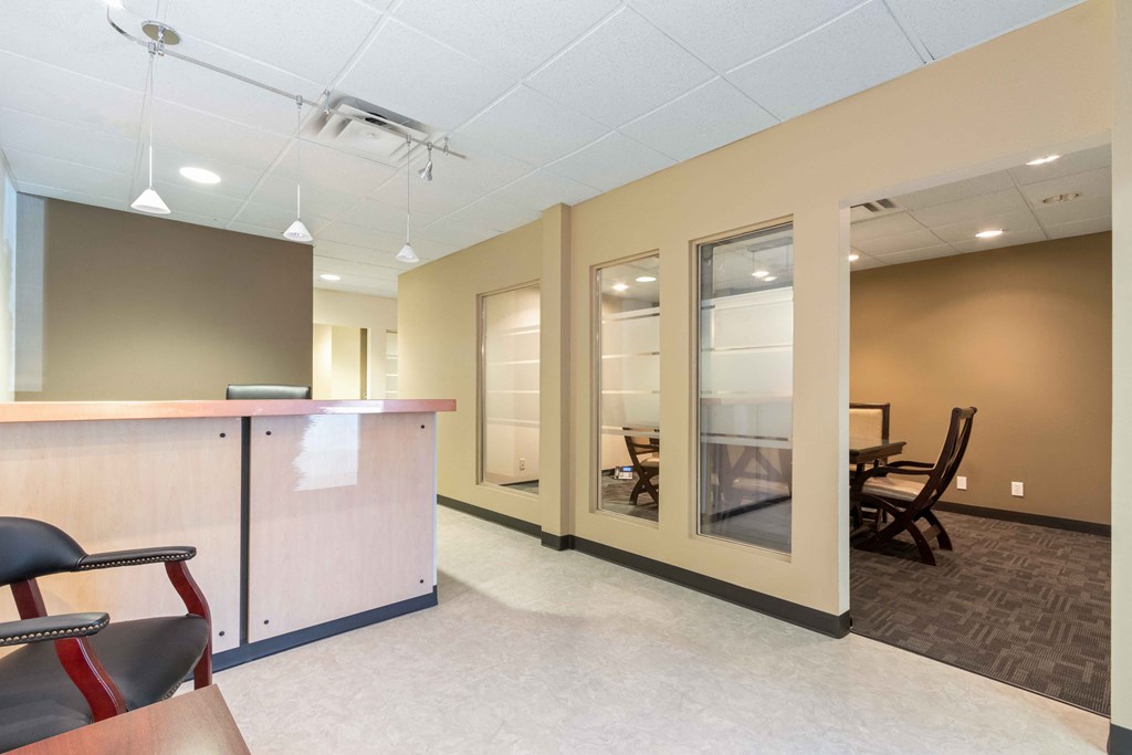 a room with chairs and a counter and a table