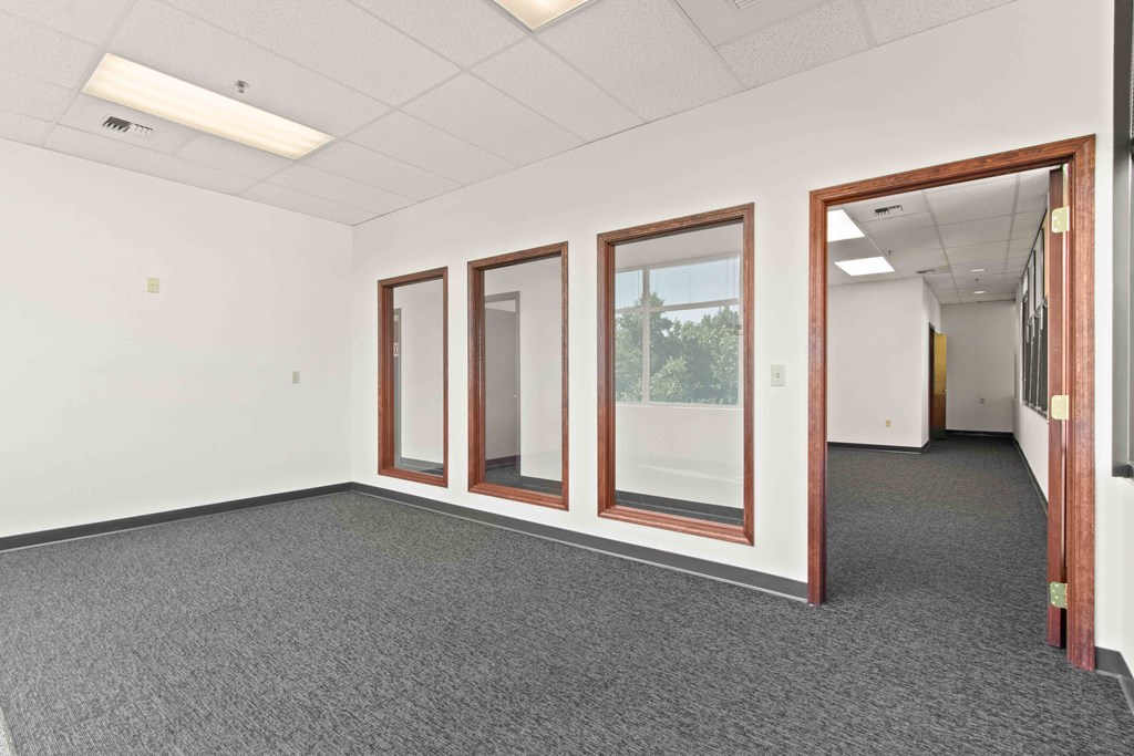 this office space is empty and has windows