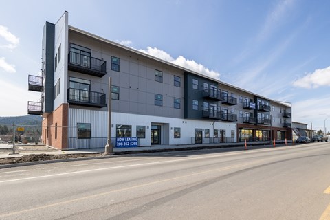 an apartment building on the side of a street