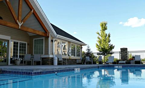 a swimming pool in front of country vista clubhouse with a resort style pool