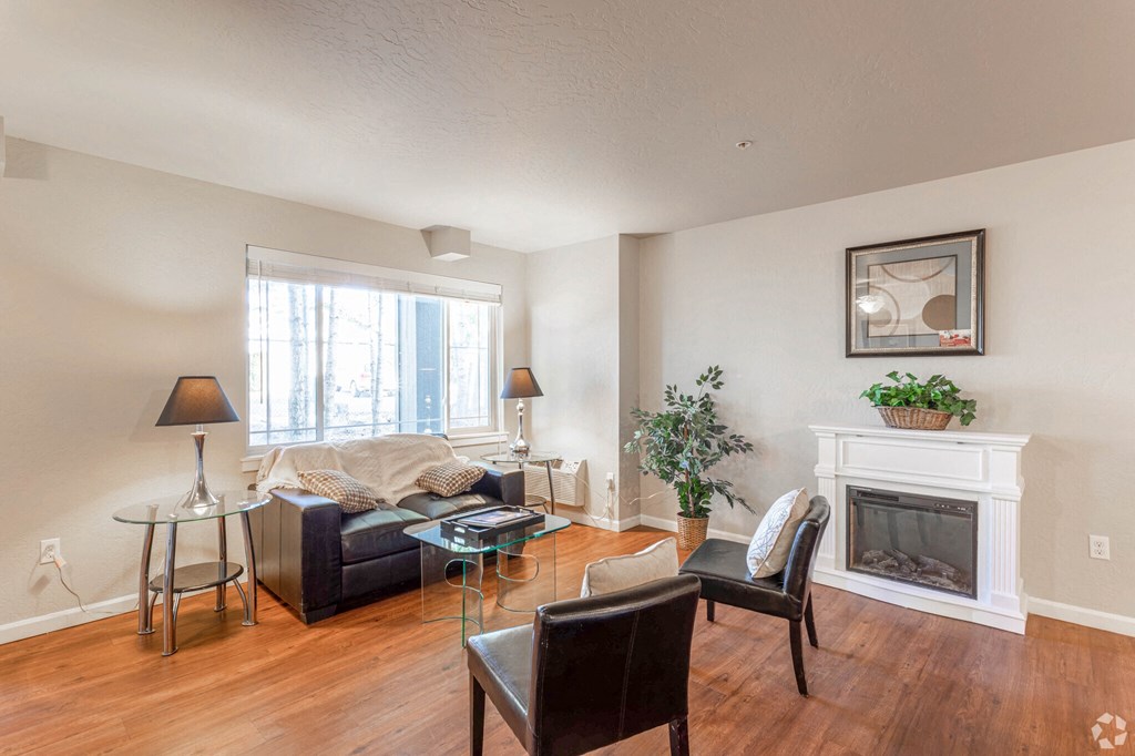 a living room with a couch and a fireplace