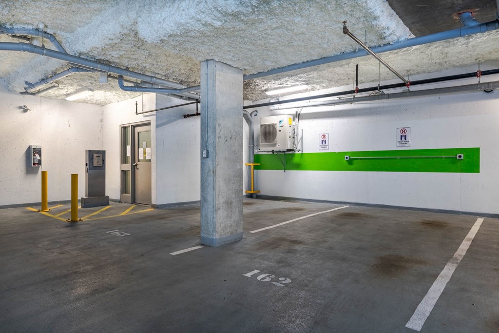 A parking garage with a white line painted on the ground.