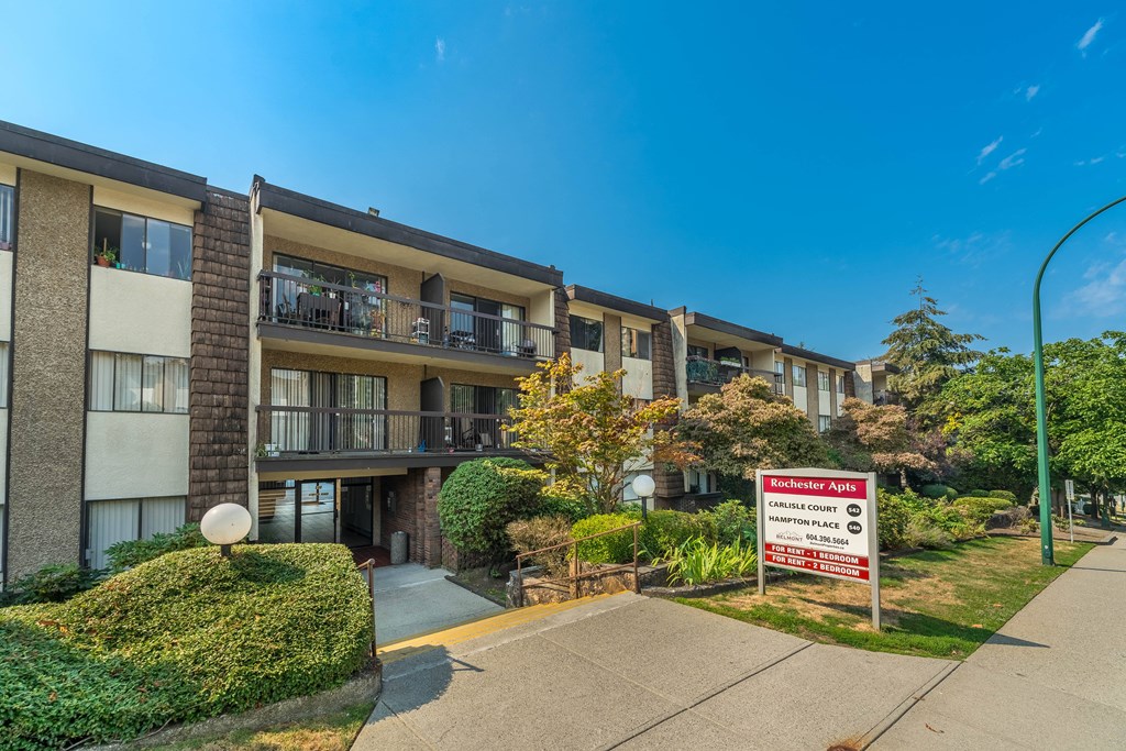 A building with a sign that says "Manchester Apart" in front of it.
