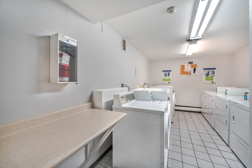A laundromat with washers and dryers.