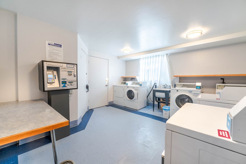 A laundromat with washers and dryers.