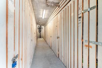 A long hallway with wooden panels on the walls and doors.