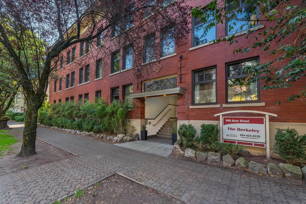A red brick building with a sign that says "The Berkeley".