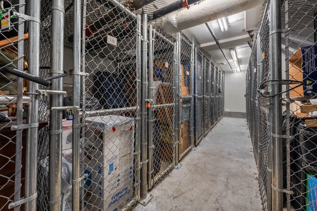 A long corridor with metal fences on both sides.