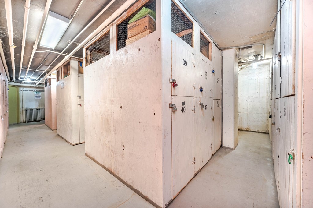 A long hallway with white walls and doors labeled 38, 40, and 42.