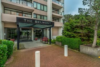 The Belmont is a modern apartment building with a brick entrance.