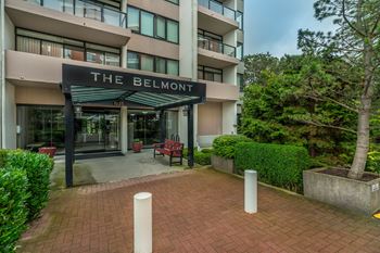 The Belmont is a modern apartment building with a brick entrance.