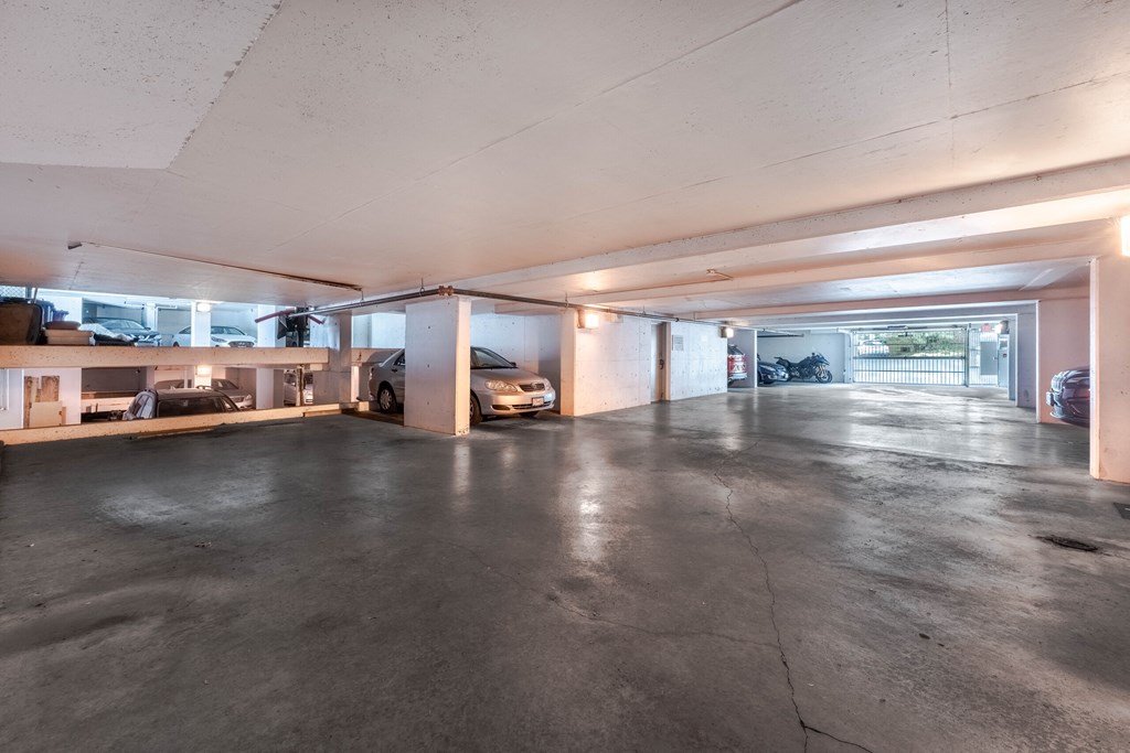 A spacious garage with a concrete floor and a white ceiling.