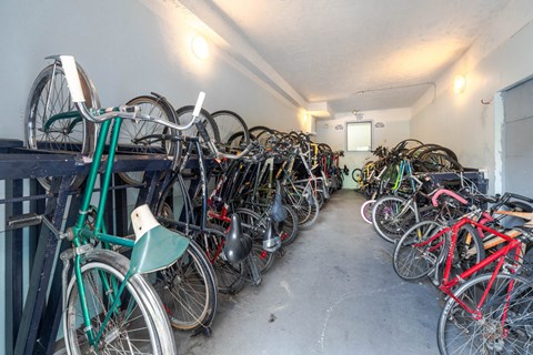 A bike rack full of bicycles.