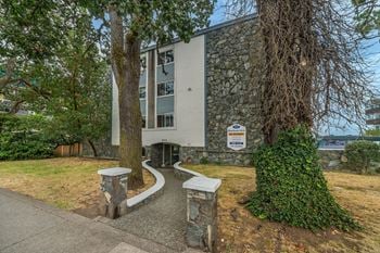 A building with a sign in front of it.