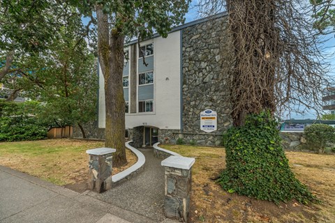 A building with a sign in front of it.